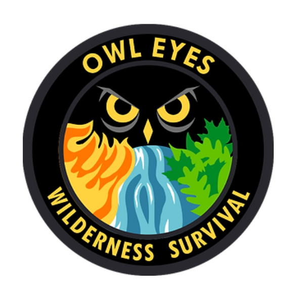 image of a black circle with a gray inner and outer border which has the words OWL EYES WILDERNESS SURVIVAL in yellow within the border.  In the inner circle, there is an image of owl eyes, with a yellow beak.  Underneath the beak is a graphic of flames, fooled by rushing water, followed by green forest
