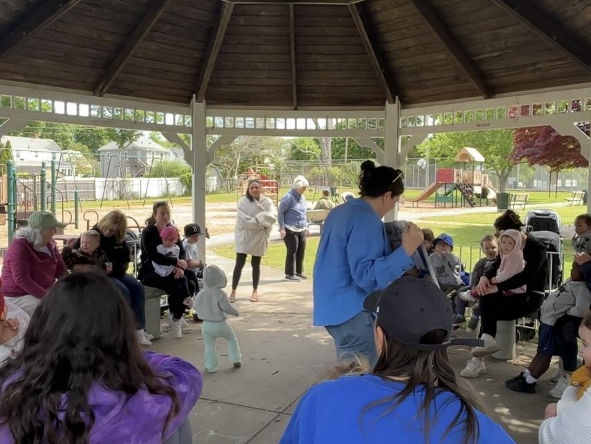 Librarian doing Storytime to a group of children