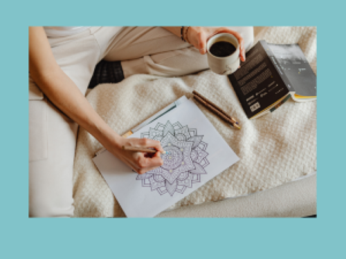 Coloring on bed with a coffee